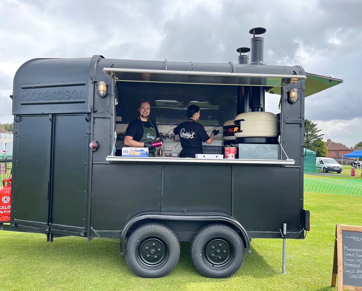 Loaded meat lovers pizza being served