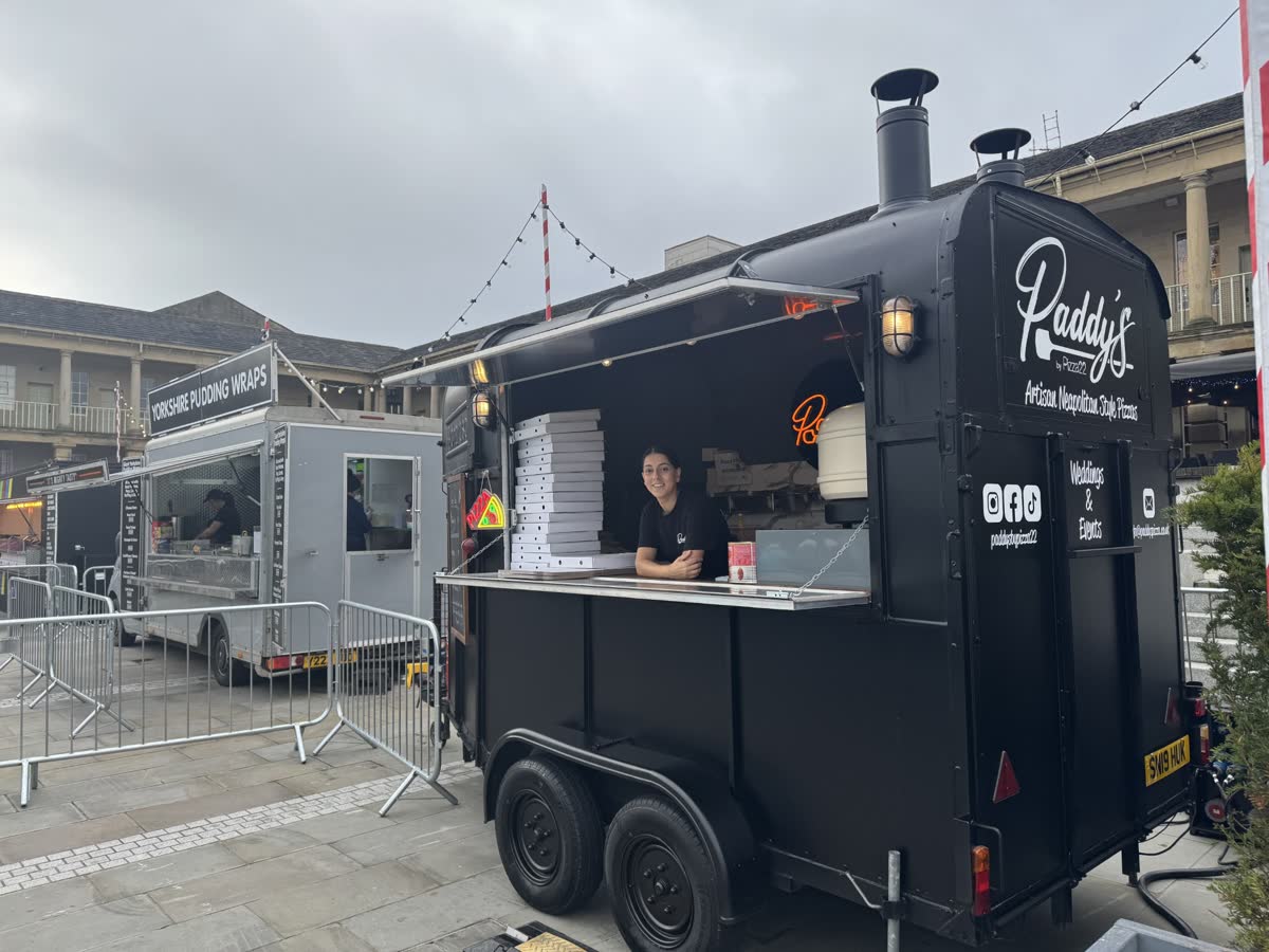 Hand-stretched pizza dough preparation at Paddy's Pizza
