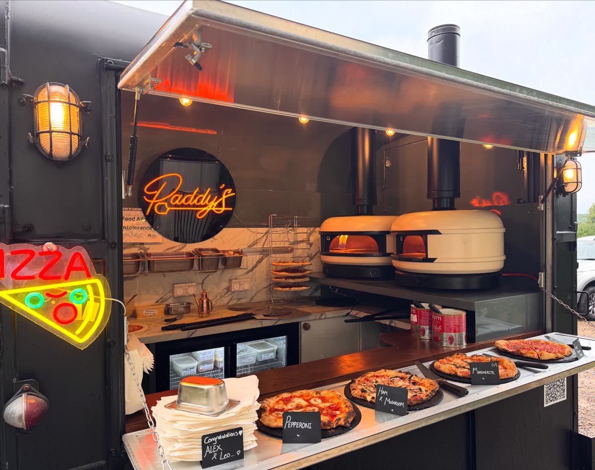 Paddy's Pizza trailer setup at wedding venue with Gozney ovens and fresh pizzas